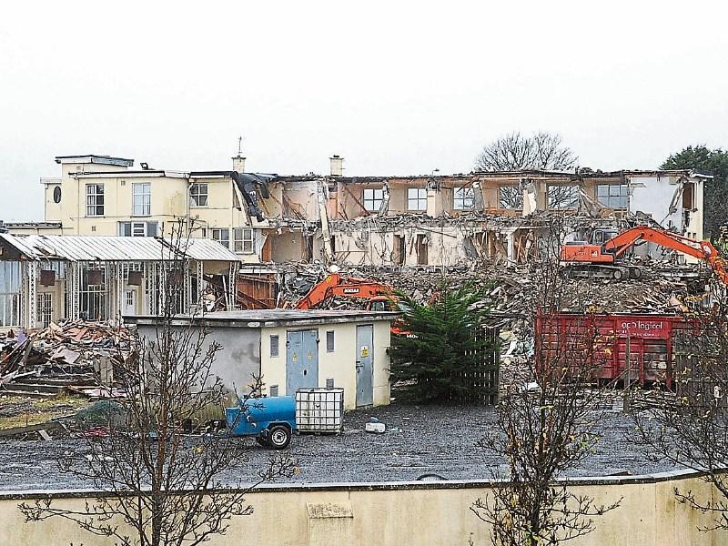 Old Fairways building bites the dust