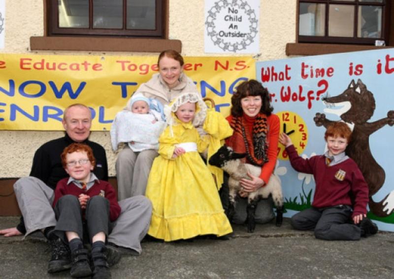 Ardee Educate Together National School principal, Ms Ann Middleton and pupils and future pupils came together to give us all a timely reminder to put your clock forward on Saturday night as summertime begins and also "Mint Sauce" the pet lamb came along to remind us that next Sunday is Easter Sunday. Pictured are Ms Ann Middleton holding "Mint Sauce" the pet lamb" as parents Paul and Ciara Boyle, Charlestown, Ardee with their children Sean, at left who is in second class, Rory, who is in senior infants, points to Mr Wolf's clock which has to go forward one hour on Saturday night, two year old Orlaith who will be a pupil in two year's time and five months old Liam who is also enrolled for 2017. Dad Paul made the new Mr Wolf clock for the school and grandfather John O'Reilly painted the clock and grandmother Margaret O'Reilly made the Little Bo Peep dress hat for Orlaith from an old evening gown. So Ardee Educate Together National School keep their pupils and our readers up to date with the start of summertime
