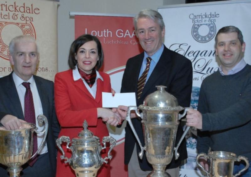 Sorcha Collins of the Carrickdale Hotel  New Sponsors of the Louth Senior Football and Hurling Championships  handing over the Sponsorship cheque to Padraig O Connor Chairman Aidan Berril Treasurer and Des Halpenny Secretary Louth Co Board  Pic Arthur KInahan
