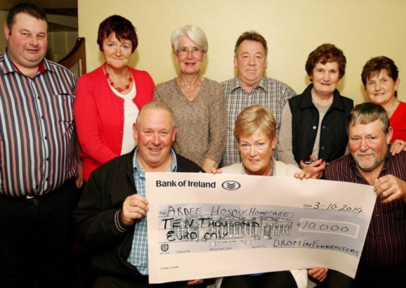 Dromin Fundraisers chairman Larry Monaghan, seated left and vice-chairman Francis Ward, seated right presenting a cheque for �10,000.00, the proceeds of their annual sponsored cycle on June 21st to Breege Conlon, chairperson Ardee Hospice Homecare at a function in the Village Saloon, Dromin. At back are from left : Ken Byrne, Dromin Fundraisers and proprietor Village Saloon, Breda Boylan, Dromin Fundraisers, Catherine Young, Ardee Hospice Homecare, Gerry McKenny, Dromin Fundraisers, Mary Hand, Ardee Hospice Homecare, Frances Larkin and Peter Flanagan, Dromin Fundraisers. In six years the Dromin Fundraisers have presented �87,000.00 to Ardee Hospice Homecare from their annual sponsored cycle