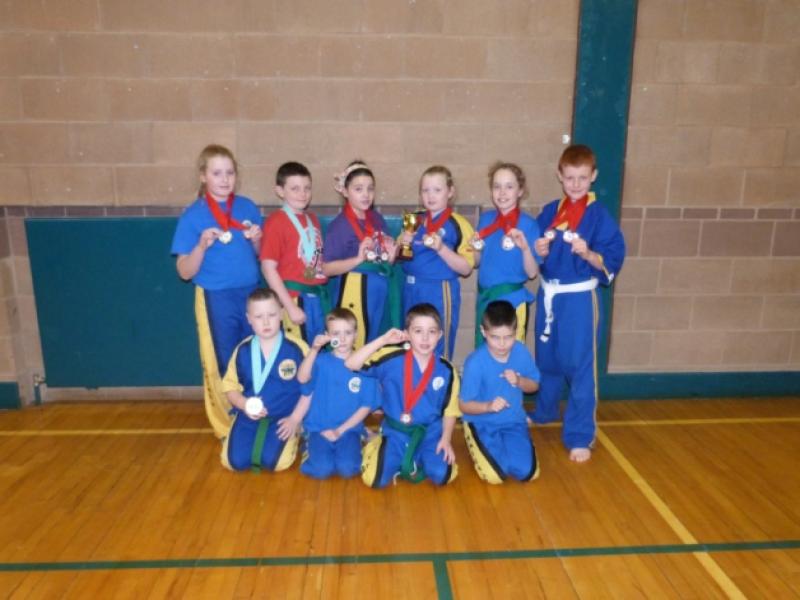 Members of the North East Mugendo Kickboxing Club pictured with their medals