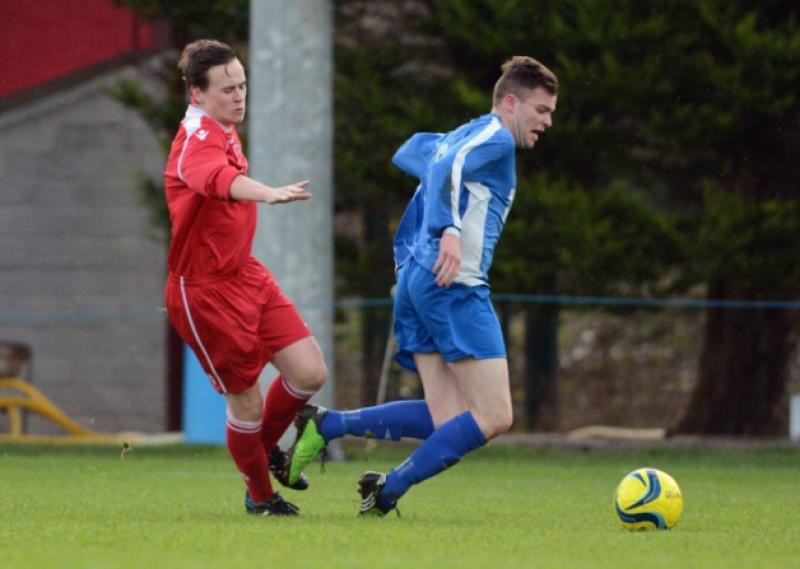 Muirhevnamor's Paul Mallon is brought down by Rock Celtic's Conor McDonnell