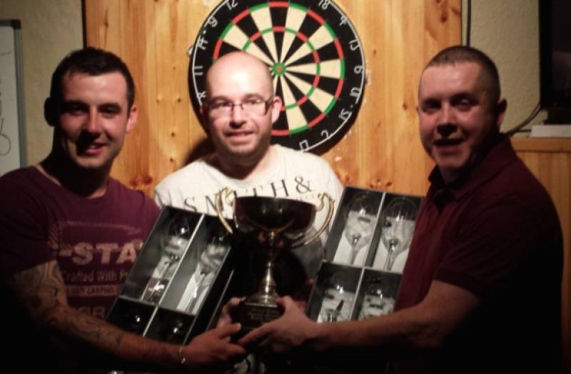 John O'Brien (right) and Gerard McKeown (left) receive the Michael Quigley Memorial Perpetual Trophy from Daniel Dunn