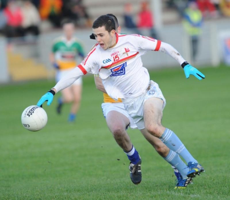 Newtown Blues' Robert Carr stretching the Tullamore defence